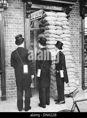 Sept. 21, 1939 - London, England, U.K. - Boys of Eton School find the place changed when they returned from their summer vacation in 1939. Here three boys, carrying gas masks, examine the sandbagged entrance to an air raid shelter. (Credit Image: © KEYSTONE Pictures USA/ZUMAPRESS.com) Stock Photo