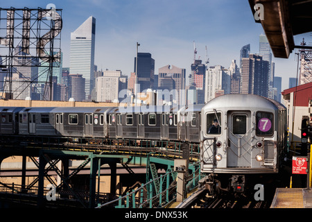 Number seven 7 train, Flushing bound, arrives at a station in Queens, New York City, USA. Stock Photo