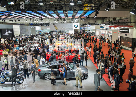 Interior view of exhibition hall at Tokyo Motor Show 2013 with large crowds of visitors Stock Photo