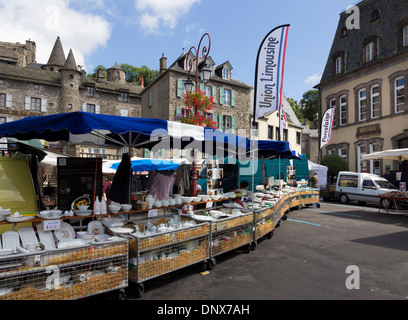 Murat, Cantal, Auvergne, France - 9 Aug 2013: A street market stall in the centre of Murat selling Limousin porcelain Stock Photo