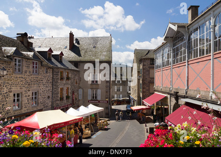 Murat, Cantal, Auvergne, France - 9 Aug 2013: A street market scene in the centre of town outside the covered market Stock Photo