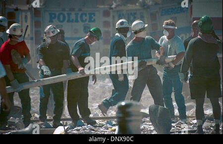 FILE PHOTO - The second tower was attacked about forty five minutes after the first. First responders of all types, Police, Fire Dept, medical personel converged on the scene immediately after the first attack and were then caught in the middle when the second jet crashed into WTC. When the second tower collapsed many hundreds of emergency responders perished. The wreckage of the t Stock Photo