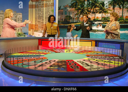 Dec 10, 2005; Ft. Lauderdale, FL, USA; Wheel of Fortune contestant coordinator Shannon Bobillo, left, coaches the contestants on how to spin and maintain enthusiasm during a practice session for taping of the show's second 'Fun In The Sun' segment at the Broward County Convention Center in Ft. Lauderdale Saturday, Dec. 10, 2005. Shows from the Ft. Lauderdale taping will air in mid- Stock Photo