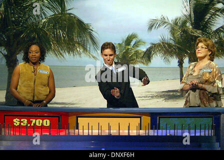 Dec 10, 2005; Ft. Lauderdale, FL, USA; Wheel of Fortune contestant Thomas Dunn III of West Palm Beach, middle, makes a joking gesture for the wheel to keep spinning during taping of the show's second 'Fun In The Sun' segment at the Broward County Convention Center in Ft. Lauderdale Saturday, Dec. 10, 2005. Shows from the Ft. Lauderdale taping will air in mid-February. Competing wit Stock Photo