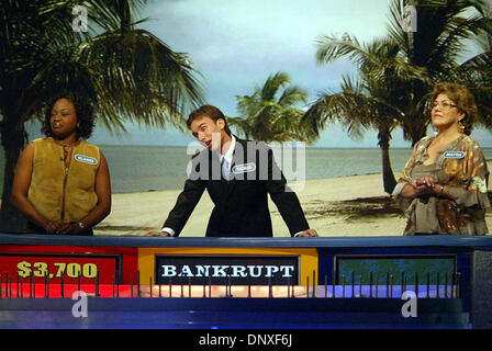 Dec 10, 2005; Ft. Lauderdale, FL, USA; Wheel of Fortune contestant Thomas Dunn III of West Palm Beach, middle, makes a joking face as the wheel lands on 'Bankrupt' during taping of the show's second 'Fun In The Sun' segment at the Broward County Convention Center in Ft. Lauderdale Saturday, Dec. 10, 2005. Shows from the Ft. Lauderdale taping will air in mid-February. Competing with Stock Photo