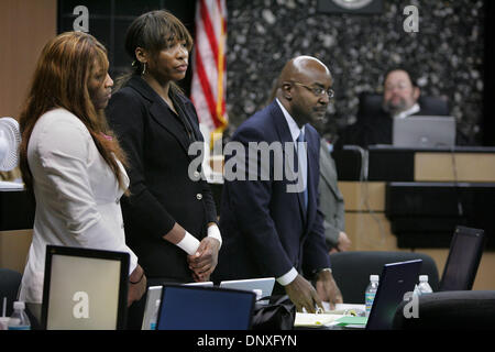 Dec 12, 2005; West Palm Beach, FL, USA; Serena Williams ,left, sister Venus Williams , center and attorney F. Malcolm Cunningham stand as the jury enters  in Judge Jeffrey Winikoff's courtroom  Monday. The Williams sisters and their father are defendants in a lawsuit contending that Richard Williams committed them to playing in the proposed 'Battle of the Sexes' tournament. The law Stock Photo