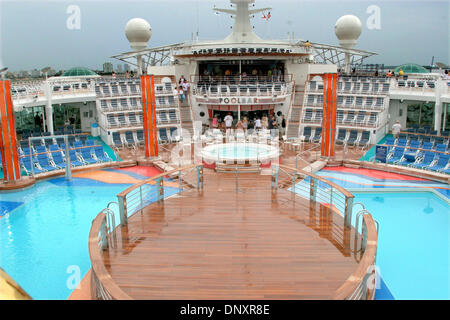 May 26, 2006 - Miami, Florida, USA - Views of a deck and a swimming pool and sunning area on the largest ship at sea. MS Freedom of the Seas is a cruise ship owned and operated by Royal Caribbean International. It is the namesake of Royal Caribbean's Freedom Class of cruise ships, and can accommodate over 4,300 passengers and 1,300 crew on fifteen passenger decks. In addition to tw Stock Photo