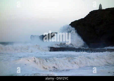 40ft waves crash into the 18th century stone pier at Portreath in Cornwall Stock Photo