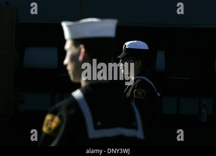 Jan 14, 2006; Ingleside, TX, USA; Seaman Apprentice Marcela Lara of Aransas Pass and Petty Officer Samuel Knapick usher attendees at the commissioning ceremony for the USS San Antonio, a US Navy Amphibious Transport Dock, at Naval Station Ingleside in Ingleside. Mandatory Credit: Photo by Mike Kane/San Antonio Express-News/ZUMA Press. (©) Copyright 2006 by San Antonio Express-News Stock Photo