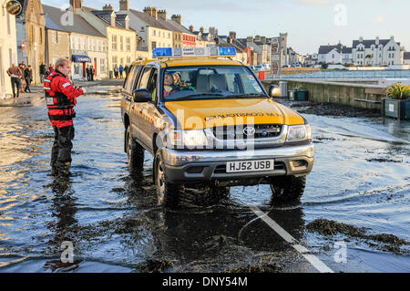 Portaferry, Northern Ireland. 6 Jan 2014 - A coastguard vehicle drives through seawater which has flooded the main road in Portaferry, Northern Ireland. The town was at risk of severe flooding caused by the high tides and the stormy weather. Credit:  Stephen Barnes/Alamy Live News Stock Photo