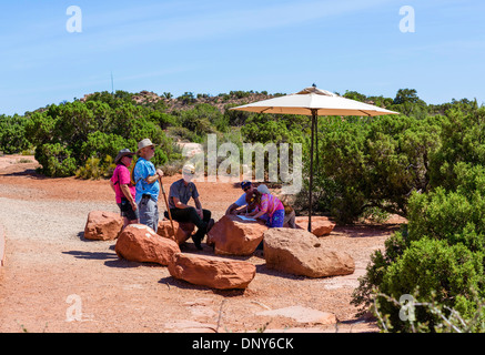 Tourists talking to a Park Ranger at Grand View Point, Island in the Sky, Canyonlands National Park, Utah, USA Stock Photo