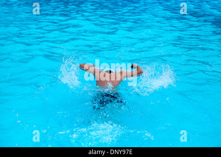 Man swimming butterfly stroke Stock Photo