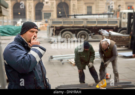 Feb 07, 2006; Turin, ITALY; A worker smokes a cigarette at the (Olympic) Medals Plaza in Turin on Wednesday. Last minute construction can be seen throughout the city as they prepare for the Olympics. Mandatory Credit: Photo by K.C. Alfred/SDU-T/ZUMA Press. (©) Copyright 2006 by SDU-T Stock Photo