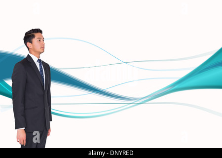 Composite image of stern businessman looking away Stock Photo