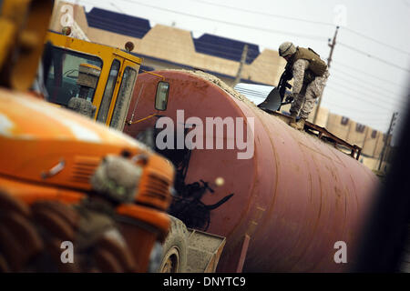 Feb 08, 2006; Al-Falujah, IRAQ; A marine from Weapons company 2nd marine division, 2nd battalion, 6th marine regiment, RCT-8, 4th platoon (callsign Black Label)  searches a tanker truck in the Iraqi city of Al-Falujah. Mandatory Credit: Photo by Toby Morris/ZUMA Press. (©) Copyright 2006 by Toby Morris Stock Photo