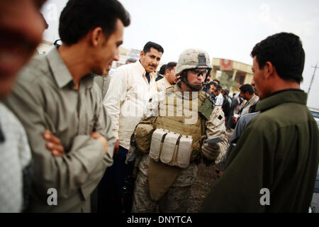 Feb 08, 2006; Al-Falujah, IRAQ; Platoon Sergeant Staff Sergeant Roy Rose, of Franklin, West Virginia a marine belonging to 2nd marine division, 2nd battalion, 6th marine regiment, RCT-8, 4th platoon (callsign Black Label)  collects IDs from a group of military age Iraqi males during a search for insurgents in the Iraqi city of Al-Falujah. Mandatory Credit: Photo by Toby Morris/ZUMA Stock Photo