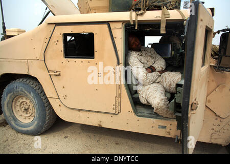 Feb 08, 2006; Al-Falujah, IRAQ; A marine from Weapons company 2nd marine division, 2nd battalion, 6th marine regiment, RCT-8, 4th platoon (callsign Black Label) takes a catnap in his HUMVEE between patrols of the Iraqi city of Al-Falujah. Mandatory Credit: Photo by Toby Morris/ZUMA Press. (©) Copyright 2006 by Toby Morris Stock Photo