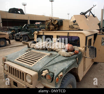 Feb 08, 2006; Al-Falujah, IRAQ; A marine from Weapons company 2nd marine division, 2nd battalion, 6th marine regiment, RCT-8, 4th platoon (callsign Black Label) takes a brief nap on the hood of his HUMVEE betwen patrols of the Iraqi city of Al-Falujah. Mandatory Credit: Photo by Toby Morris/ZUMA Press. (?) Copyright 2006 by Toby Morris Stock Photo