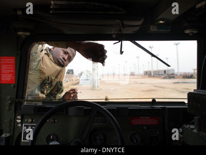 Feb 08, 2006; Al-Falujah, IRAQ; Private Raban Kimungu, A marine from Weapons company 2nd marine division, 2nd battalion, 6th marine regiment, RCT-8, 4th platoon (callsign Black Label) cleans the windshield on his HUMVEE between patrols of the Iraqi city of Al-Falujah. Mandatory Credit: Photo by Toby Morris/ZUMA Press. (©) Copyright 2006 by Toby Morris Stock Photo