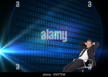 Composite image of manager relaxing in office with team in background Stock Photo