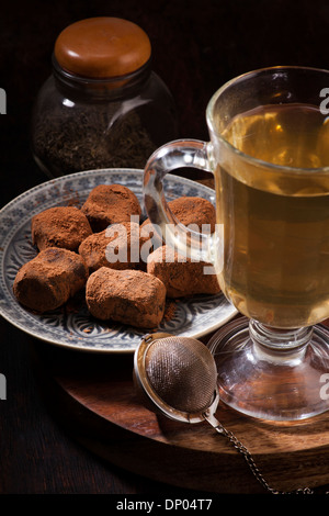 Tea and chocolate candies in a vintage style Stock Photo