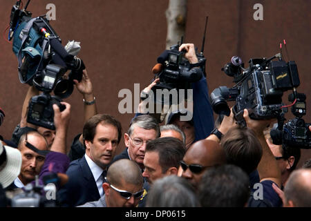 Mar 03, 2006; San Diego, CA, USA; Former Congressman RANDY 'DUKE' CUNNINGHAM, center right (with half his face obscured by the crowd), is escorted to federal court downtown San Diego Friday afternoon before being sentenced to eight years and four months in federal prison and ordered to pay $1.8 million restitution for accepting bribes.  Mandatory Credit: Photo by Nadia Borowski Sco Stock Photo