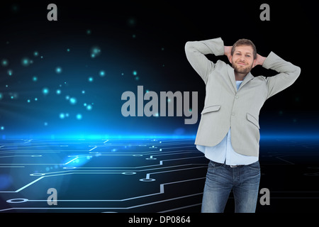 Composite image of suave man in a blazer with hands behind head looking at camera Stock Photo