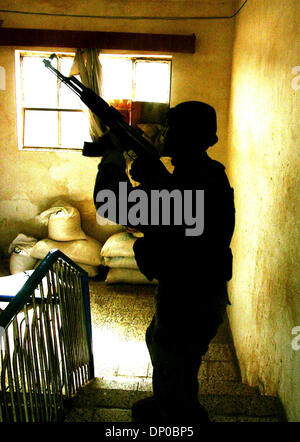 Mar 07, 2006; Ad Dawr, Saluhidin, IRAQ; An Iraqi soldier, or junedi, in a home in Ad Dawr, Iraq, during a search for an insurgent sniper who shot and wounded one American soldier. The sniper shot and wounded one American soldier before getting away. The soldier lived and was evacuated to Germany. Ad Dawr is approximately 15 miles from Tikrit and 15 miles from Samarra. 2nd of the 9t Stock Photo