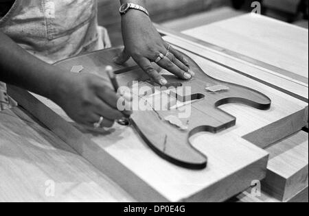 Mar 13, 2006; Corona, CA, USA; FILE PHOTO: August 2004; Corona Fender plant. The guitar body template is stenciled by hand onto the wood. This year, 2006, Fender Musical Instruments Corporation (FMIC) celebrates the 60th Anniversary of the company, which has grown from a small operation in Southern California into the world's foremost manufacturer of guitars, amplifiers, and relate Stock Photo