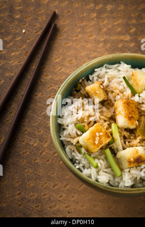 Bowl of lemon Rice with wild garlic and fried cheese Stock Photo