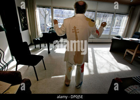 Mar 21, 2006; Minneapolis, MN, USA; Minnesota Orchestra conductor Osmo Vanska checks out the fit of a 1970's era suit that he will wear when making his debut as a pops conductor with a program of ABBA tunes. The suit was designed by Mark Caligiuri, a local designer. The fitting took place in Vanska's office at Orchestra Hall. Mandatory Credit: Photo by Jim Gehrz/Minneapolis Star T  Stock Photo