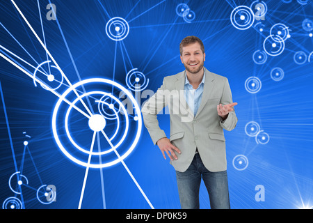 Composite image of stylish man smiling and gesturing Stock Photo