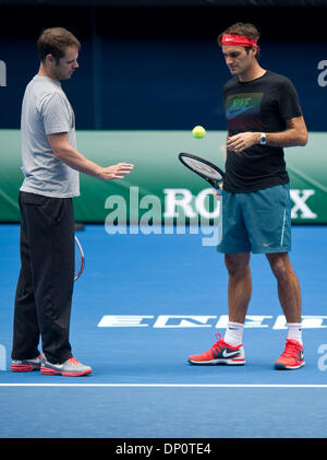 Melbourne, Australia. 7th Jan, 2014. Roger Federer (R) of Switzerland attends a training session ahead of the 2014 Australian Open at Rod Laver Arena in Melbourne, Australia, Jan. 7, 2014. Credit:  Bai Xue/Xinhua/Alamy Live News Stock Photo