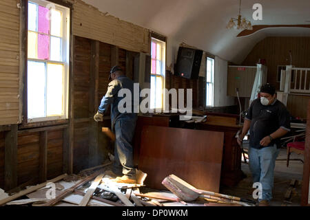 Apr 05, 2006; New Orleans, LA, USA; Edgar Joseph (left), from New Orleans, commutes weekly from Houston, where his family evacuated, to work on a crew gutting a church in New Orleans damaged by Hurricane Katrina. Alejandro Palma, a Honduran from New York City, came down to New Orleans to find work. He shares a one-bedroom apartment acros the river with two other Hondurans on the wo Stock Photo