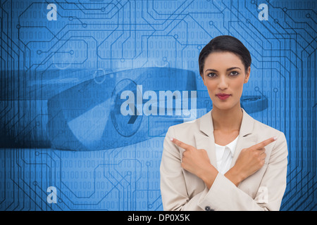 Composite image of charismatic businesswoman with her arms crossed and fingers pointing Stock Photo