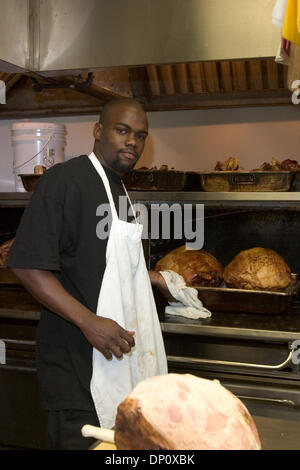 Apr 07, 2006; New Orleans, LA, USA; Mother's Restaurant in the New Orleans Central Business District. Pictured: Butcher LAWRENCE TAYLOR slices the famous baked ham. Mandatory Credit: Photo by Kayte Deioma/ZUMA Press. (©) Copyright 2006 by Kayte Deioma Stock Photo