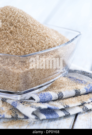 Bowl filled with Brown Sugar on wooden background Stock Photo