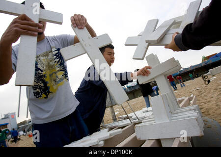 Apr 09, 2006; Santa Monica, CA, USA; Volunteers at the Arlington West Memorial set up crosses on Sunday, April 9, 2006 in Santa Monica, Calif.  The crosses represent soldiers killed in Iraq since the start of the war over three years ago. Mandatory Credit: Photo by Matthew Williams/ZUMA Press. (©) Copyright 2006 by Matthew Williams Stock Photo