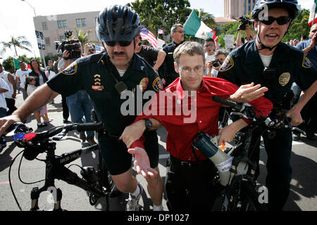 Apr 09, 2006; San Diego, CA, USA; Two San Diego Police officers on bicycles remove an anti-immigration protestor who was trying to incite the crowd of pro immigration marchers during their march on Sunday.  Mandatory Credit: Photo by John Gibbins/SDU-T/ZUMA Press. (©) Copyright 2006 by SDU-T Stock Photo