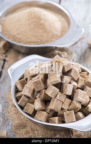 Bowl filled with Brown Sugar on wooden background Stock Photo