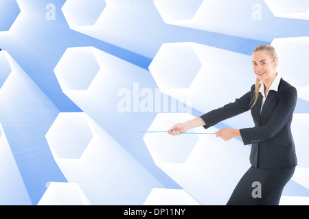 Composite image of businesswoman pulling a rope Stock Photo