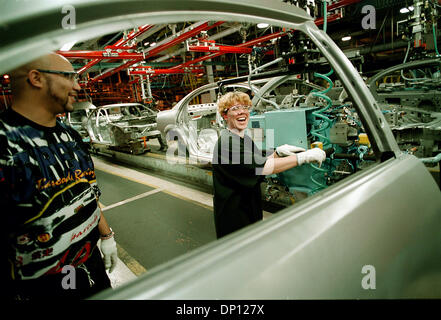 Apr 13, 2006; Detroit, MI, USA; (FILE PHOTO: Exact date 07-29-2001) DaimlerChrysler to Sell Manufacturing Assets from Sterling HeightsAssembly Plant. Pictured: In the DaimlerChrysler Sterling Heights Assembly Plant, new doors for the Chrylser Sebring Sedan are moved into place by James Beasley, from the Sterling Heights Stamping Plant, visiting, inspecting parts, helping door insta Stock Photo