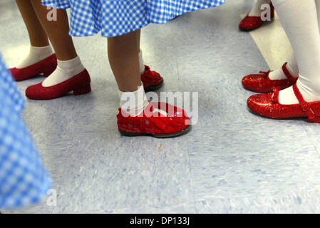 Apr 13, 2006; Port St. Lucie, FL, USA; There were many ruby slippers at Floresta Elementary School. These Dorothys were among about 40 students at the school who participated in The Wizard of Oz parade. Students from every class were encouraged to dress up as a character from The Wizard of Oz. Dorothy was, by far, the most popular character. Each student donated  to to participate  Stock Photo