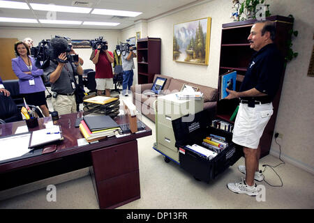 Apr 14, 2006; San Antonio, TX, USA; San Antonio Police Department Chief Albert Ortiz, right, fills boxes in his office Friday morning April 14, 2006 as television cameras film the process.  Mandatory Credit: Photo by William Luther/ZUMA Press. (©) Copyright 2006 by San Antonio Express-News Stock Photo