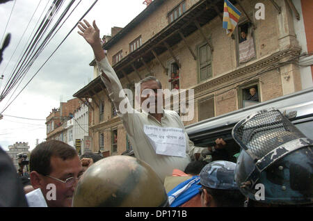 Apr 22, 2006; Kathmandu, NEPAL; Demonstration time in Nepal: Seven opposition democratic parties and anti-monarchy protesters were defying the curfew order of the government to restore a democratic republic in Nepal. During this movement 15 people were killed by security personnel and hundreds of people were badly injured. King Gyanendra addressed the people trying to undo his 1 Fe Stock Photo