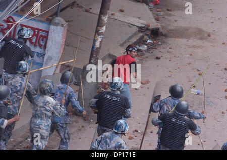 Apr 22, 2006; Kathmandu, NEPAL; Demonstration time in Nepal: Seven opposition democratic parties and anti-monarchy protesters were defying the curfew order of the government to restore a democratic republic in Nepal. During this movement 15 people were killed by security personnel and hundreds of people were badly injured. King Gyanendra addressed the people trying to undo his 1 Fe Stock Photo