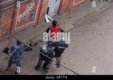 Apr 22, 2006; Kathmandu, NEPAL; Demonstration time in Nepal: Seven opposition democratic parties and anti-monarchy protesters were defying the curfew order of the government to restore a democratic republic in Nepal. During this movement 15 people were killed by security personnel and hundreds of people were badly injured. King Gyanendra addressed the people trying to undo his 1 Fe Stock Photo