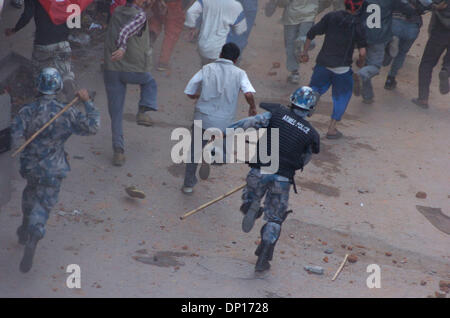 Apr 22, 2006; Kathmandu, NEPAL; Demonstration time in Nepal: Seven opposition democratic parties and anti-monarchy protesters were defying the curfew order of the government to restore a democratic republic in Nepal. During this movement 15 people were killed by security personnel and hundreds of people were badly injured. King Gyanendra addressed the people trying to undo his 1 Fe Stock Photo