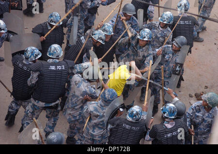 Apr 22, 2006; Kathmandu, NEPAL; Demonstration time in Nepal: Seven opposition democratic parties and anti-monarchy protesters were defying the curfew order of the government to restore a democratic republic in Nepal. During this movement 15 people were killed by security personnel and hundreds of people were badly injured. King Gyanendra addressed the people trying to undo his 1 Fe Stock Photo