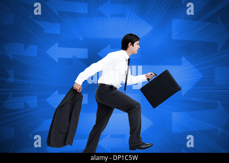 Composite image of side view of walking tradesman with jacket and suitcase Stock Photo